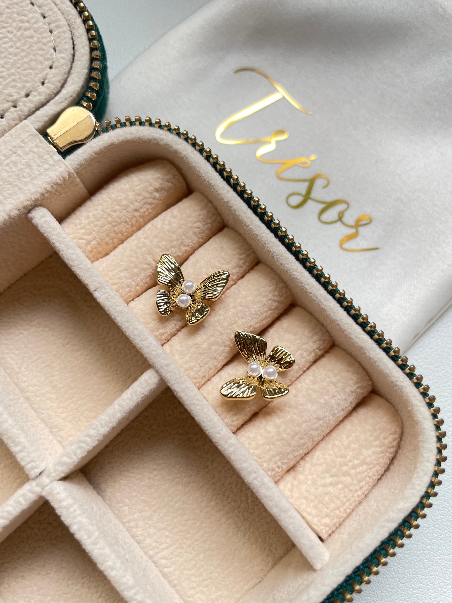 Butterfly and pearl earrings